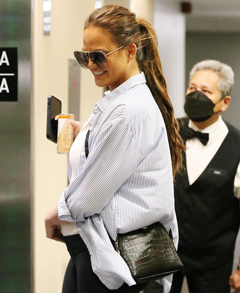 LOS ANGELES, CA - AUGUST 8: Chrissy Teigen and John Legend at medical building on August 8, 2022 in ...