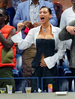 Bella Hadid cheers on serena williams at the us open wearing a dolce & gabbana denim corset 