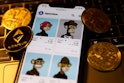 Bored Ape Yacht Club collection in OpenSea displayed on a phone screen, representation of cryptocurr...