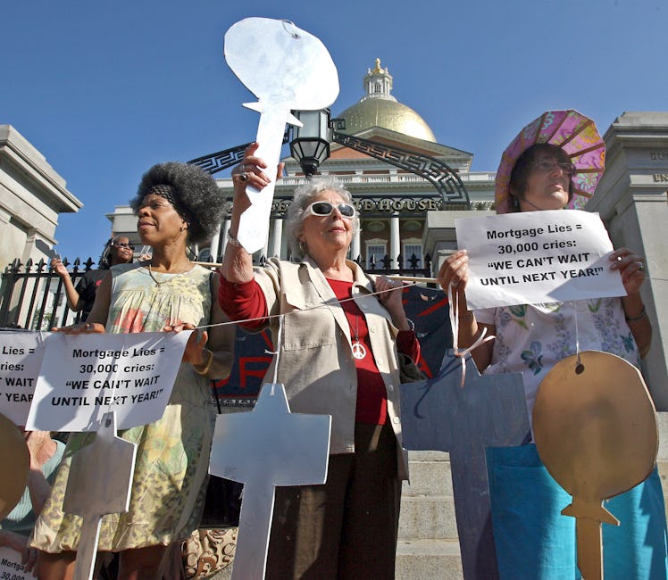 (07/29/08-Boston,MA) LtoR Paula Tayor, Jean Wassell and Virginia Pratt protest for some relief from ...