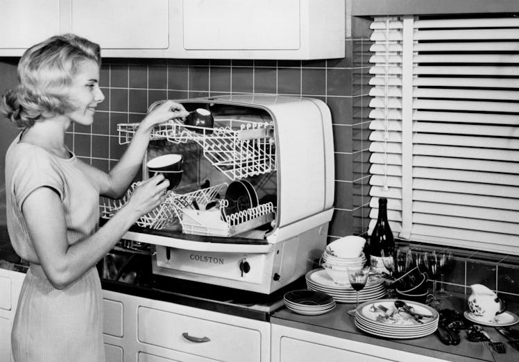 Demonstrating the Colston dishwasher, 18 November 1959. This dishwasher, made by Charles Colston Ltd...