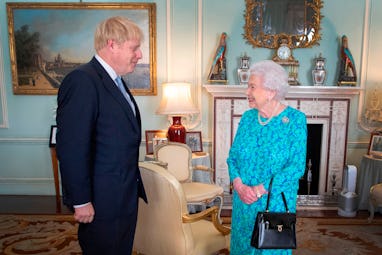 Britain's Queen Elizabeth II welcomes newly elected leader of the Conservative party, Boris Johnson ...