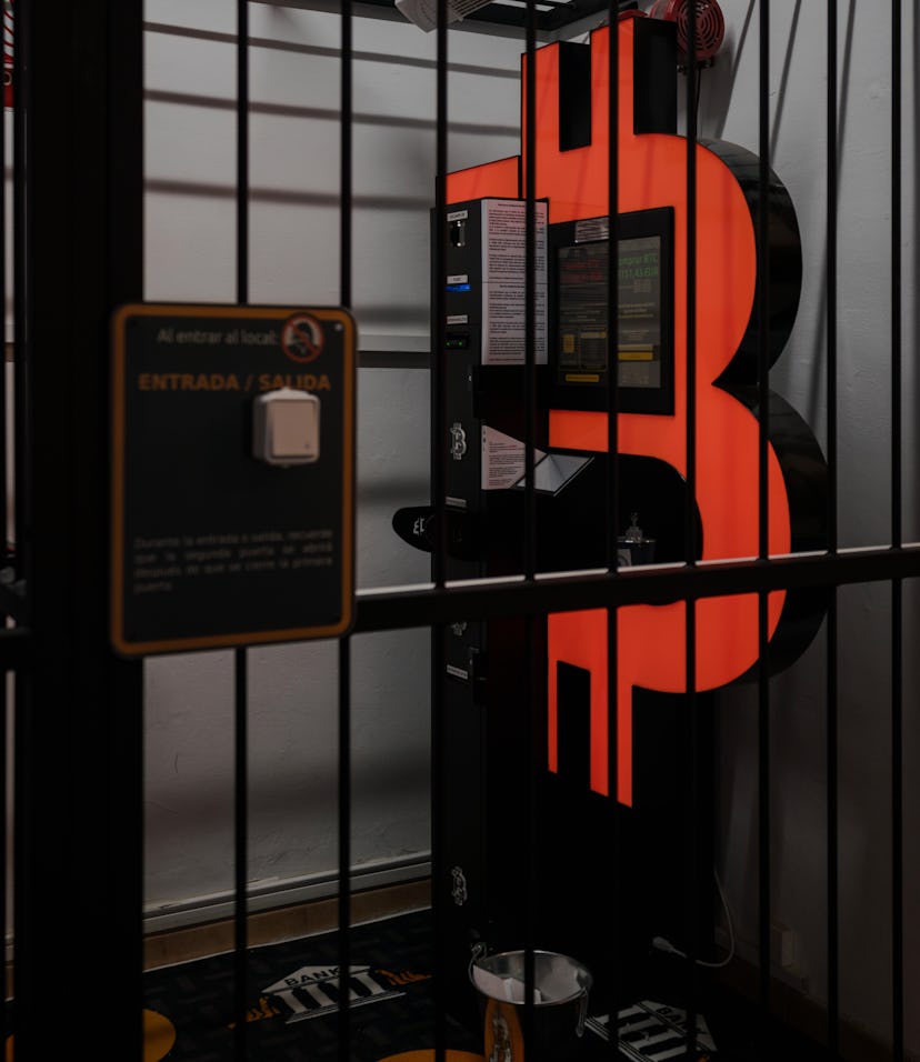 BARCELONA, SPAIN - JANUARY 29: A Bitcoin ATM machine, to buy or sell cryptocurrencies, is placed wit...