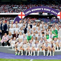 LONDON, ENGLAND - JULY 31: Players and staff of England celebrate with the UEFA Women’s EURO 2022 Tr...