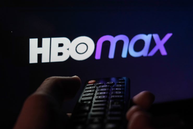 TV remote control is seen with HBO Max logo displayed on a screen in this illustration photo taken i...