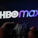TV remote control is seen with HBO Max logo displayed on a screen in this illustration photo taken i...
