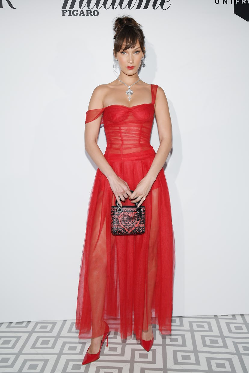 Bella Hadid wearing a red dress and pumps at a Dior dinner during the 2018 Cannes Film Festival 