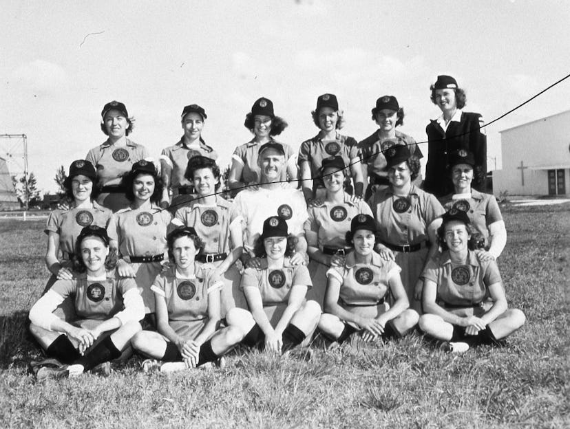 ROCKFORD, ILLINOIS - 1944. The Rockford Peaches of the All American Girls Baseball League pose for …