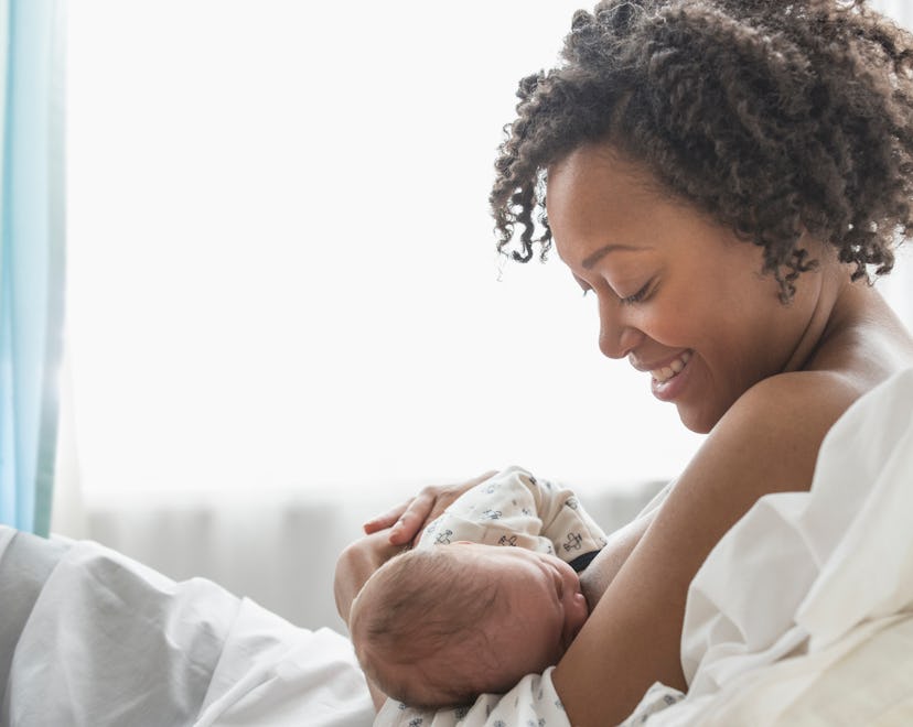 a mother and baby in a breastfeeding session in an article about newborn choking or coughing while b...