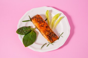 Smoked Salmon on pink background in studio