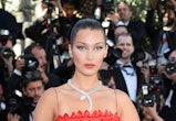 Bella Hadid wearing a red dior gown at the 2017 cannes film festival 