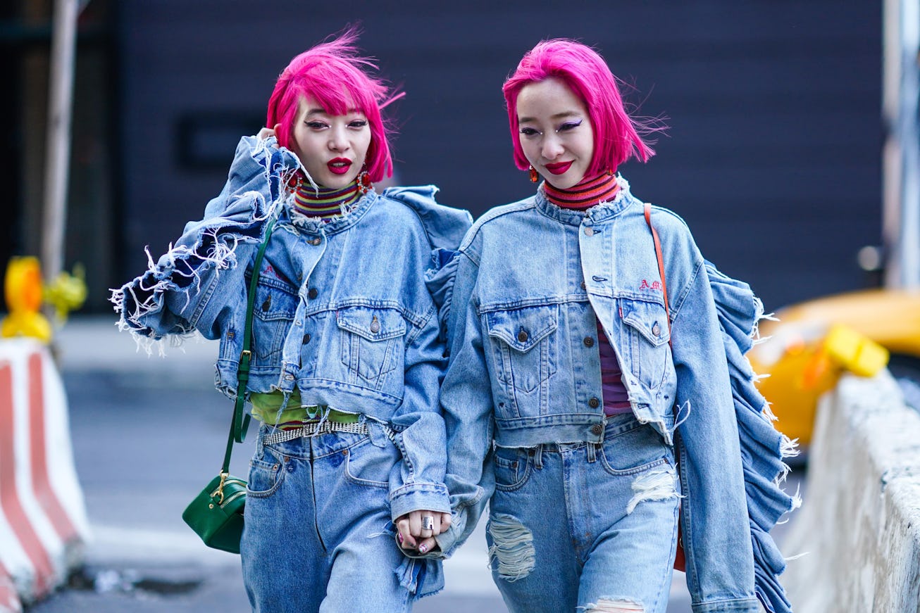 NEW YORK, NEW YORK - FEBRUARY 07: Fashion twins Ami & Aya "AmiAya" are seen wearing a striped turtle...