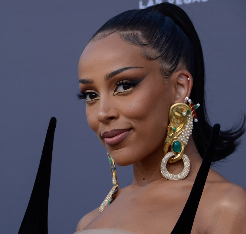 Doja Cat reacts to concerns on her mental health after shaving her head, saying she's fine — and ric...