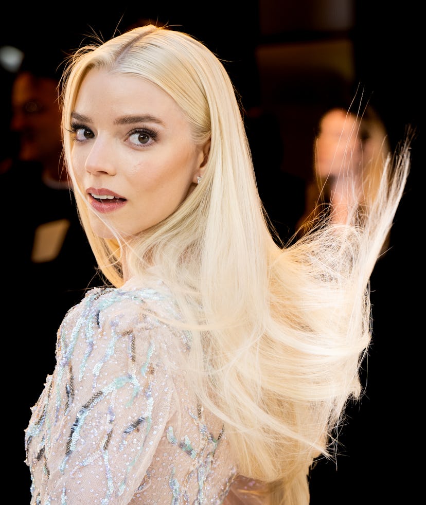 Anya Taylor-Joy rocks platinum blonde hair, one of fall 2022’s hair color trends to watch.