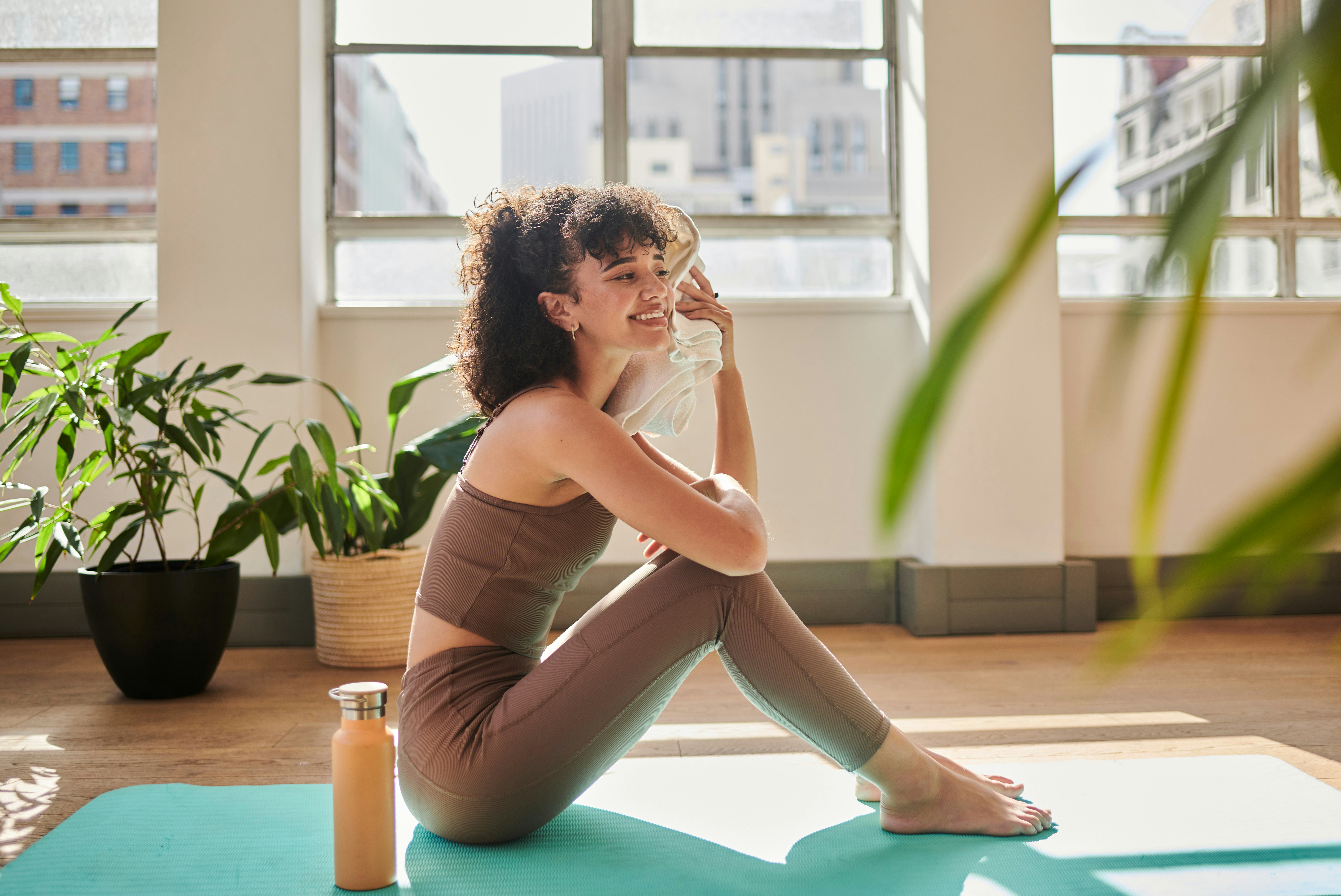 Core Pilates workouts for abs that you can do at home includes crunches on your exercise mat.