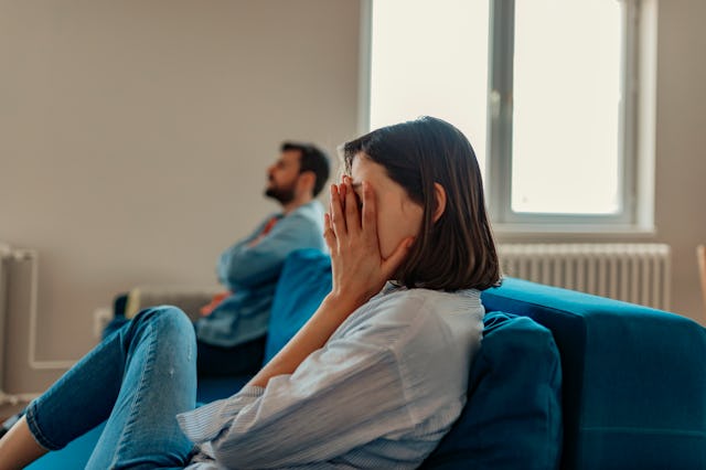 Unhappy Couple After an Argument in the Living Room at Home. Sad Pensive Young Girl Thinking of Rela...