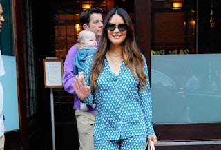 Olivia Munn knows kicks from babies are a part of the mom deal. Here, she and John Mulaney depart th...