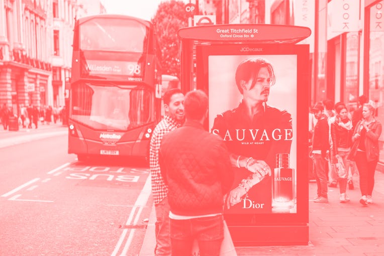 London, UK - People on an Oxford Street pavement near a bus stop, as a double-decker bus arrives. Th...