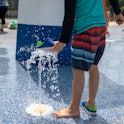 WASHINGTON, D.C.  - MAY 21: Josiah Li, 5, plays in a splash pad at Turkey Thicket Recreation Center ...