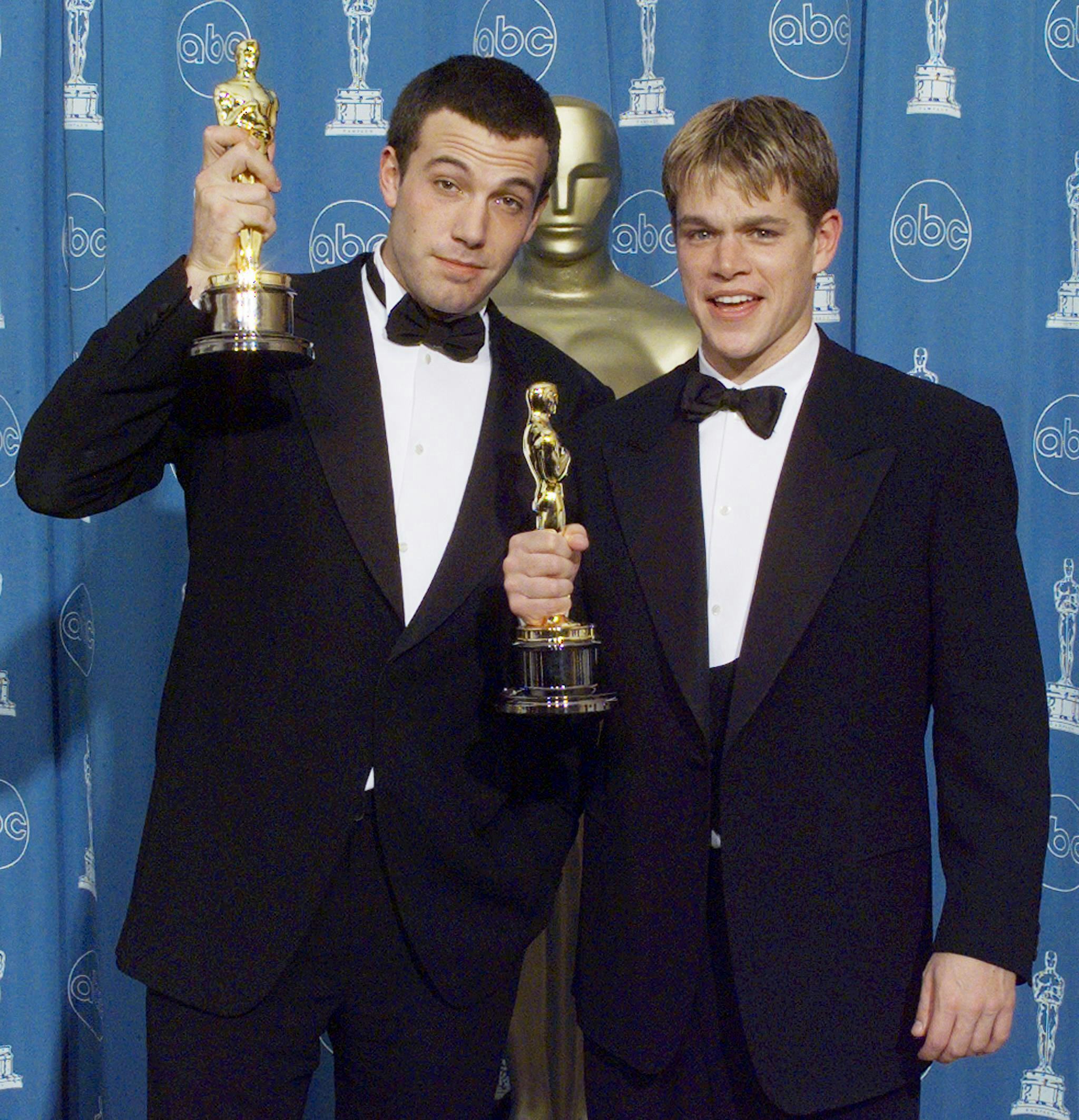 Matt Damon (R) and Ben Affleck (L) pose with their Oscars they won for Best Original Screenplay for &hellip;