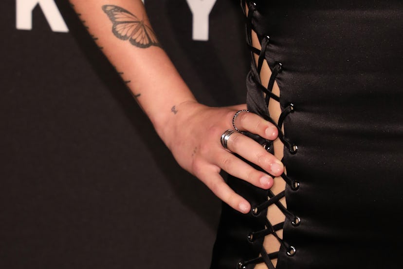 Halsey has a butterfly tattoo on their forearm.