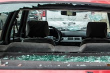 LA BISBAL D'EMPORDA, GIRONA, CA, SPAIN - AUGUST 31: The window of a broken vehicle, as a consequence...