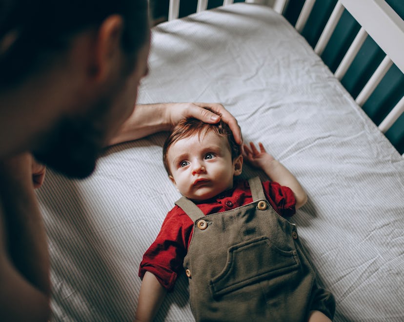Dad comforting baby after he was coughing at night