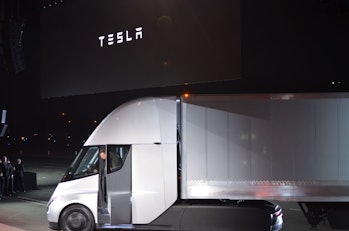 Tesla Chairman and CEO Elon Musk steps out of the new "Semi" electric Truck during the unveiling for...