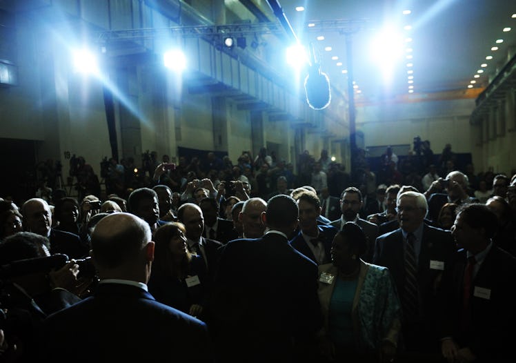 US President Barack Obama (C-back) greets members of the audience after speaking on the bold new cou...