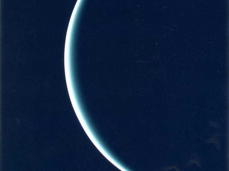 25th January 1986: The crescent of Uranus as recorded by Voyager 2, on its way to Neptune. The pale ...