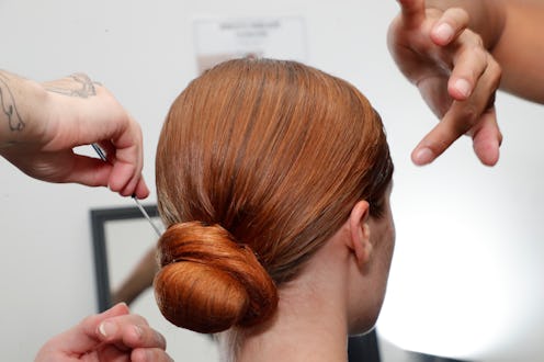 NEW YORK, NEW YORK - SEPTEMBER 07:  A model is getting prepared backstage during TRESemme X Christia...