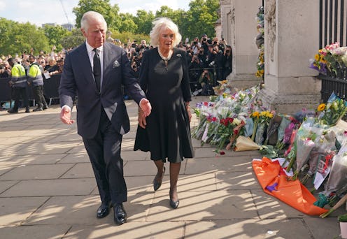 LONDON, ENGLAND - SEPTEMBER 09: King Charles III and Camilla, Queen Consort view tributes left outsi...