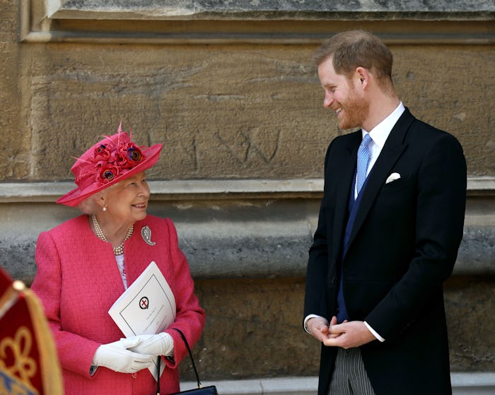WINDSOR, ENGLAND - MAY 18: Queen Elizabeth II speaks with Prince Harry, Duke of Sussex as they leave...