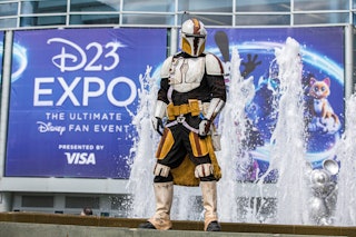 "The Mandalorian" cosplayer Nathan Seekerman poses outside Disney's D23 Convention on September 11, ...