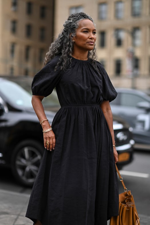 NEW YORK, NEW YORK - SEPTEMBER 11: Mara Akil Brock is seen wearing a black dress outside the Ulla Jo...