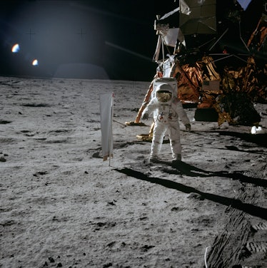 Lunar Module Pilot Edwin 'Buzz' Aldrin standing next to the Solar Wind Composition experiment, part ...