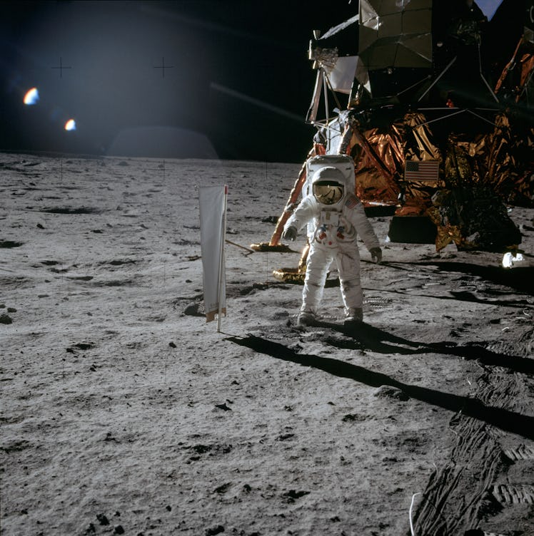 Lunar Module Pilot Edwin 'Buzz' Aldrin standing next to the Solar Wind Composition experiment, part ...