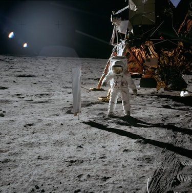 Lunar Module Pilot Edwin 'Buzz' Aldrin standing next to the Solar Wind Composition experiment, part ...
