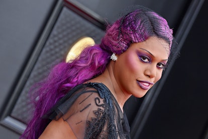Laverne Cox attends the 2022 GRAMMY Awards wearing 90s skinny brows