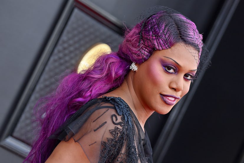 Laverne Cox attends the 2022 GRAMMY Awards wearing 90s skinny brows