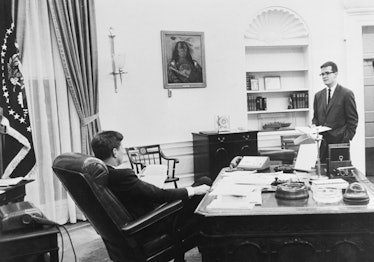 (Original Caption) Washington: 5:50 p.m.: With another message to Congress coming up, Mr. Kennedy ta...