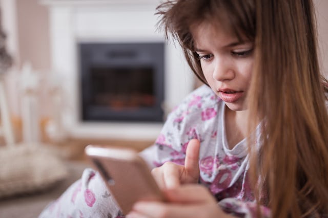 A girl dialing a phone in distress. New information shows that most kids don't know how to dial 911 ...