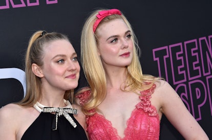 US actress Elle Fanning (R) and her sister actress Dakota Fanning arrive for the Los Angeles special...