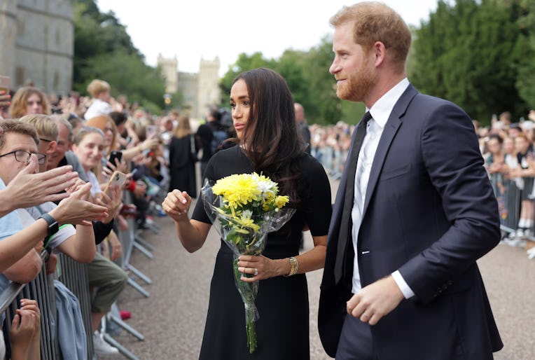 WINDSOR, ENGLAND - SEPTEMBER 10: Meghan Duchess of Sussex and Prince Harry, Duke of Sussex speak wit...