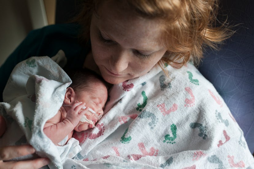 NICU baby is nurtured by mother in an article about the meaning of NICU