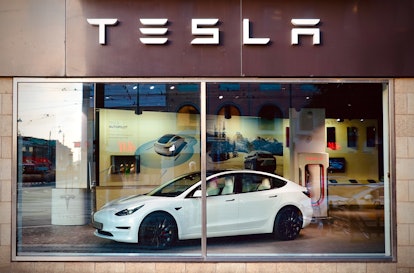 06 August 2022, Sweden, Göteborg: A Tesla S car sits in the window of the Tesla Motors automotive st...