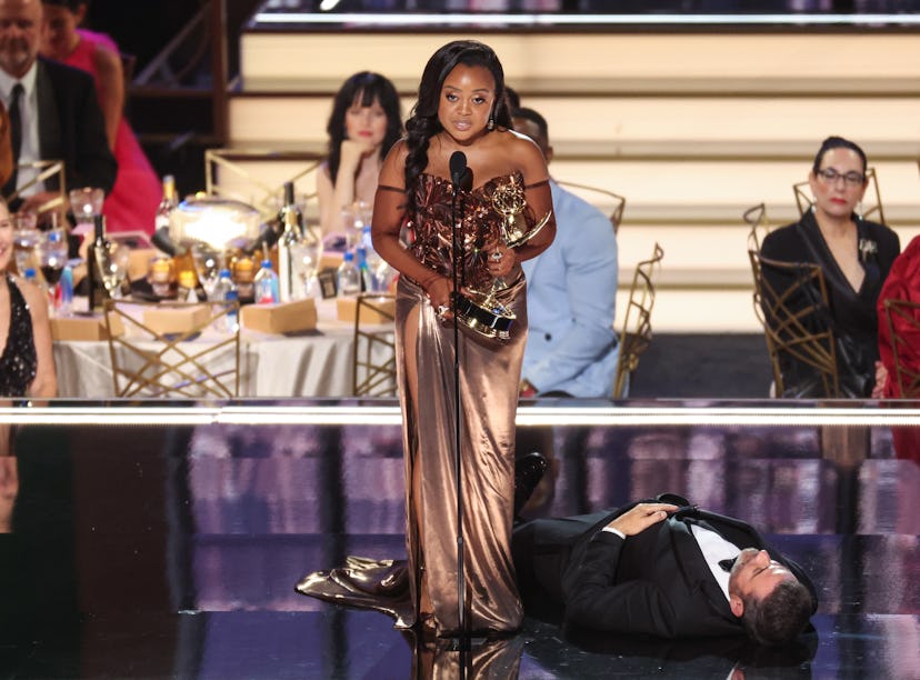 Jimmy Kimmel lies onstage as Quinta Brunson accepts her Emmy Award
