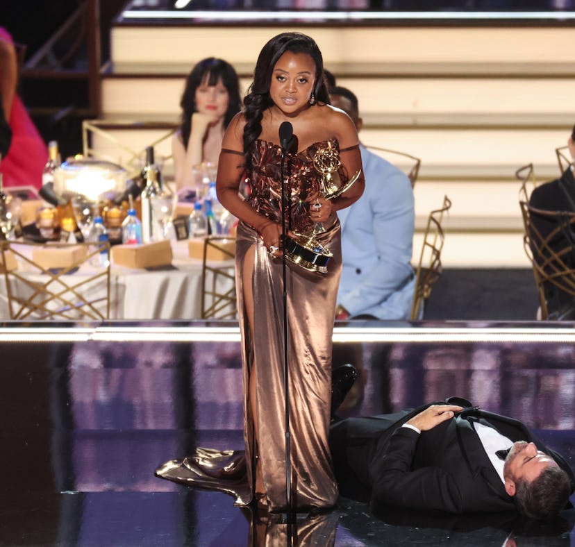 Jimmy Kimmel lies onstage as Quinta Brunson accepts her Emmy Award