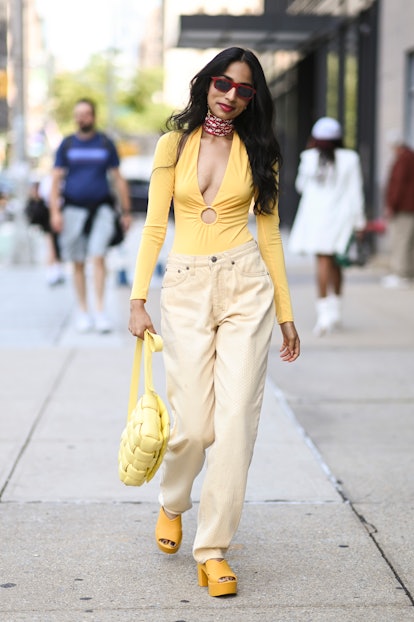 Malvika Sheth is seen wearing a yellow outfit during New York Fashion Week. 