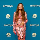Chrissy Teigen cradling her baby bump at the 2022 Emmys